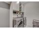 Laundry room with built-in cabinets and sink at 8648 Cloverbelle St, Las Vegas, NV 89166