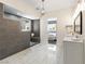 Modern bathroom with double vanity and marble floor at 5865 Egan Crest Dr, Las Vegas, NV 89149