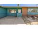 House exterior featuring teal paint, brick accents, and a side entrance at 425 Oil Lantern Ln, Las Vegas, NV 89145