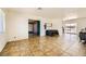 Open living area with tile floors and access to other rooms at 425 Oil Lantern Ln, Las Vegas, NV 89145