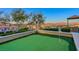 Private putting green with stunning views of community and lake at 22 Via Vasari # 101, Henderson, NV 89011