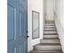 Entryway with stairs and blue door at 5507 Big Red Ct # 101, Las Vegas, NV 89122