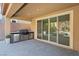 Outdoor kitchen and patio with built-in grill, leading to a spacious backyard at 2144 Havensight Ln, Henderson, NV 89052