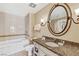 Bathroom with a bathtub, shower, and granite vanity at 30 Strada Di Villaggio # 513, Henderson, NV 89011