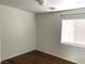 Simple bedroom with hardwood floors and a window at 7451 Grizzly Giant St, Las Vegas, NV 89139