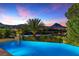 Stunning infinity pool overlooking lake and mountain views at 17 Grand Corniche Dr, Henderson, NV 89011