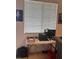 Bright home office with a desk and window with blinds at 50 Aura De Blanco St # 2104, Henderson, NV 89074