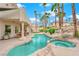 Relaxing pool and spa with a rock waterfall feature at 8838 Spanish Mountain Dr, Las Vegas, NV 89148