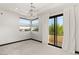 Bedroom with private balcony access and a crystal chandelier at 34 Cranberry Cove Ct, Las Vegas, NV 89135