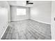 Well-lit bedroom featuring tile flooring and a ceiling fan at 601 Harvest Run Dr # 102, Las Vegas, NV 89145