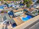 High angle view of a backyard, showcasing a pool, patio, and storage shed at 3827 Silent Hill Dr, Las Vegas, NV 89147