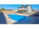 Inviting pool with a safety fence and surrounding patio at 3827 Silent Hill Dr, Las Vegas, NV 89147