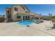 Spacious backyard featuring a refreshing pool, hot tub, and patio area at 537 Viva Serenade Way, Henderson, NV 89015