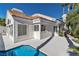 Bright and sunny backyard with a glistening pool at 8125 Sunset Cove Dr, Las Vegas, NV 89128