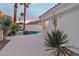 Landscaped backyard with a private pool and spa at 8125 Sunset Cove Dr, Las Vegas, NV 89128