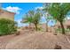 Landscaped backyard with gravel and trees at 10717 Grand Cypress Ave, Las Vegas, NV 89134