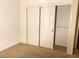 Bedroom with double door closet and shelving at 10717 Grand Cypress Ave, Las Vegas, NV 89134