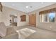 Living room features a view and neutral color palette at 10717 Grand Cypress Ave, Las Vegas, NV 89134