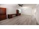 Spacious living room with wood-look floors, built-in shelving, and chandelier at 3053 Lenoir St, Las Vegas, NV 89135