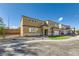 Two-story house with tan exterior, white shutters, and a landscaped yard at 9742 Rocket Grove Ct, Las Vegas, NV 89178