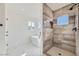 Spa-like bathroom with walk-in shower and soaking tub at 9742 Rocket Grove Ct, Las Vegas, NV 89178