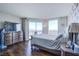 Bright bedroom with hardwood floors and large windows at 322 Karen Ave # 3907, Las Vegas, NV 89109