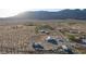 Aerial view of property showcasing a house and expansive desert landscape at 1661 W Duck St, Pahrump, NV 89060