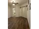 Bedroom with wood-look floors, walk-in closet, and sliding door at 8721 Red Brook Dr # 203, Las Vegas, NV 89128