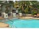 Inviting pool and spa area with pergola and lounge chairs at 8721 Red Brook Dr # 203, Las Vegas, NV 89128