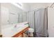 Clean bathroom with a single vanity, shower/tub, and shelves at 6901 Squaw Mountain Dr # 201, Las Vegas, NV 89130