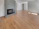 Bright living room with hardwood floors and a fireplace at 6416 Dinning Ave, Las Vegas, NV 89107