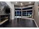 Main bedroom with fireplace, city views, and dark hardwood floors at 1228 Stellar Rim Ct, Henderson, NV 89012