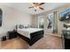 Spacious bedroom with a large bed, TV, and nightstands at 5919 Karnes Ranch Ave, Las Vegas, NV 89131