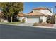 Two-story house with attached garage and landscaping at 5452 Big Sky Ln, Las Vegas, NV 89149