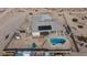 Aerial view of a house with a pool and surrounding desert landscape at 675 Claridge Ave, Logandale, NV 89021