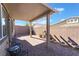 Relaxing backyard with covered patio and seating area at 1302 Paseo Del Oso Ln, Henderson, NV 89002