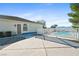 Relaxing pool area with a white fence and spacious patio at 2500 S Zephyr Ave, Pahrump, NV 89048