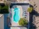 Aerial view of kidney-shaped pool with surrounding patio at 2500 S Zephyr Ave, Pahrump, NV 89048