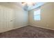 Well-lit bedroom, carpeted floor and ceiling fan at 2664 Chinaberry Hill St, Laughlin, NV 89029