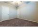 Bright bedroom featuring carpeted floor and ceiling fan at 2664 Chinaberry Hill St, Laughlin, NV 89029