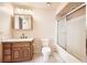 Clean bathroom with shower/tub combo and wood vanity at 340 E Longacres Dr, Henderson, NV 89015