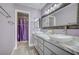 Double vanity bathroom with marble countertops and a shower at 2725 S Nellis Blvd # 2121, Las Vegas, NV 89121