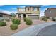 Two-story house with a two-car garage and landscaped front yard at 3008 Chiefs Ct, North Las Vegas, NV 89032