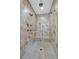 Spacious walk-in shower with multiple shower heads and bench seating at 4093 San Franchesca Ct, Las Vegas, NV 89141