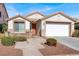 Single-story home with a two-car garage and well-maintained landscaping at 2326 Bahama Point Ave, North Las Vegas, NV 89031