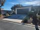 Front view of single story home with attached garage at 3137 Asoleado Cir, Las Vegas, NV 89121