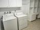 Laundry room with washer, dryer, cabinets, and shelving at 3137 Asoleado Cir, Las Vegas, NV 89121