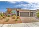 Modern home with two-car garage and landscaped front yard at 3367 Peak View Ave, Henderson, NV 89044