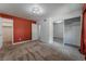 Spacious bedroom with mirrored closet doors and red accent wall at 2451 N Rainbow Blvd # 2051, Las Vegas, NV 89108