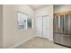 Bright dining area with tile floor and sliding door to outside at 6041 Riverwalk Falls St # 102, North Las Vegas, NV 89031